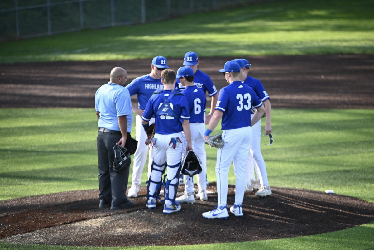 Bo Schlarman (9), Andrew Forton (9), and Braden McDowell (9) discuss their strategy to finish and win the game. 